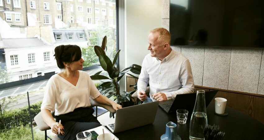 man and woman discussing and sharing ideas