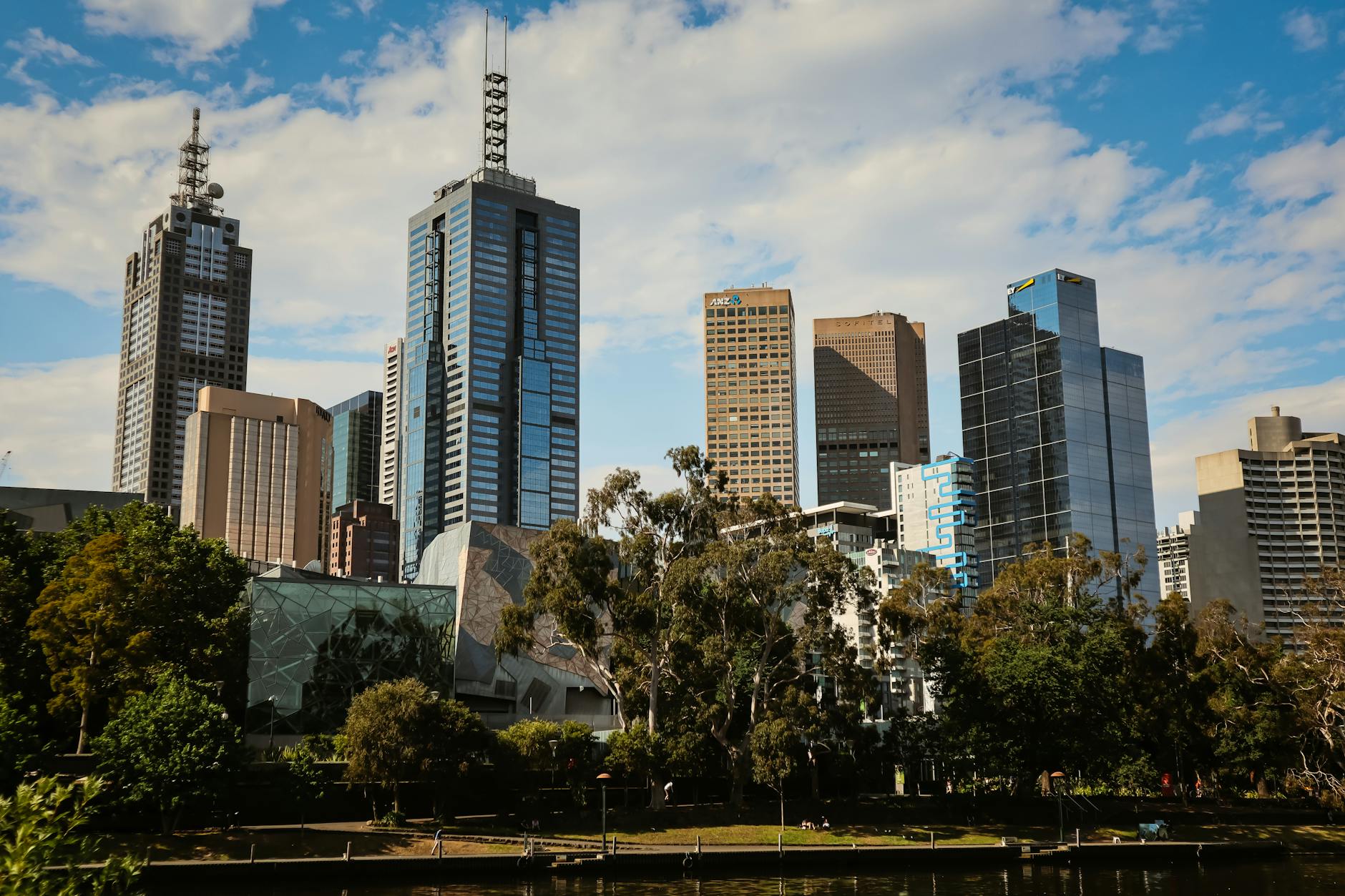 park near modern building during daylight