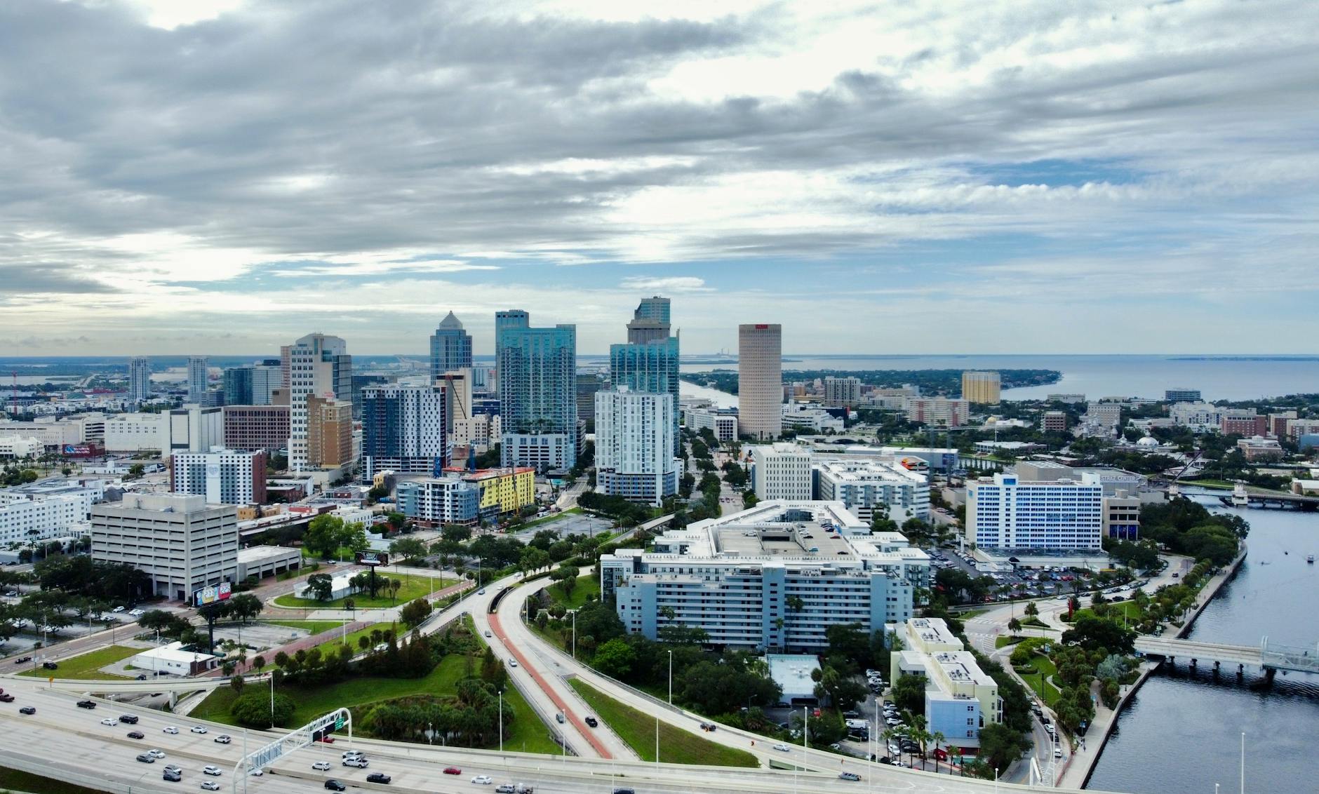 aerial view of city buildings near body of water