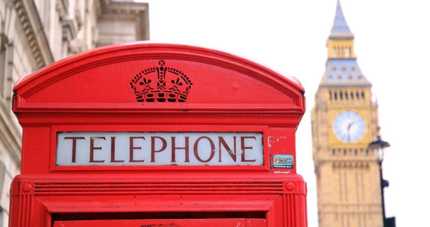 red telephone booth in front of big ben