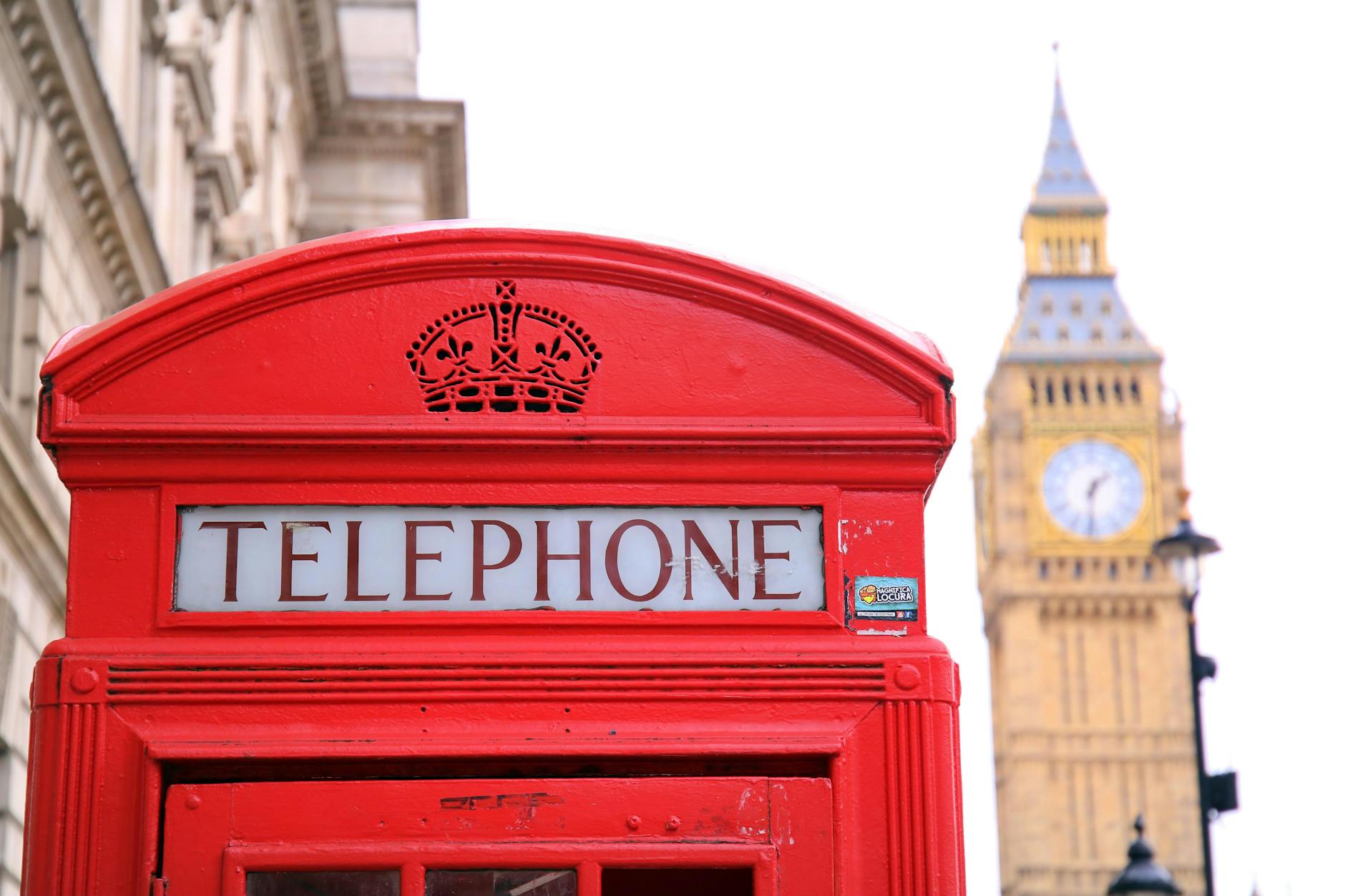 red telephone booth in front of big ben