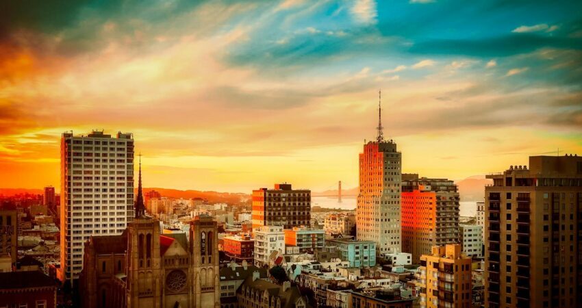 buildings under cloudy sky during sunset